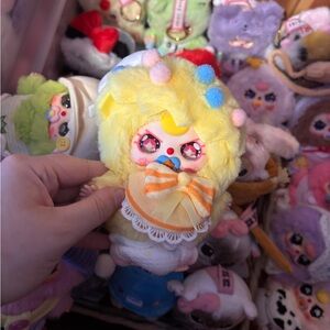 Colorful Plush Toy with Yellow and Pink Accents